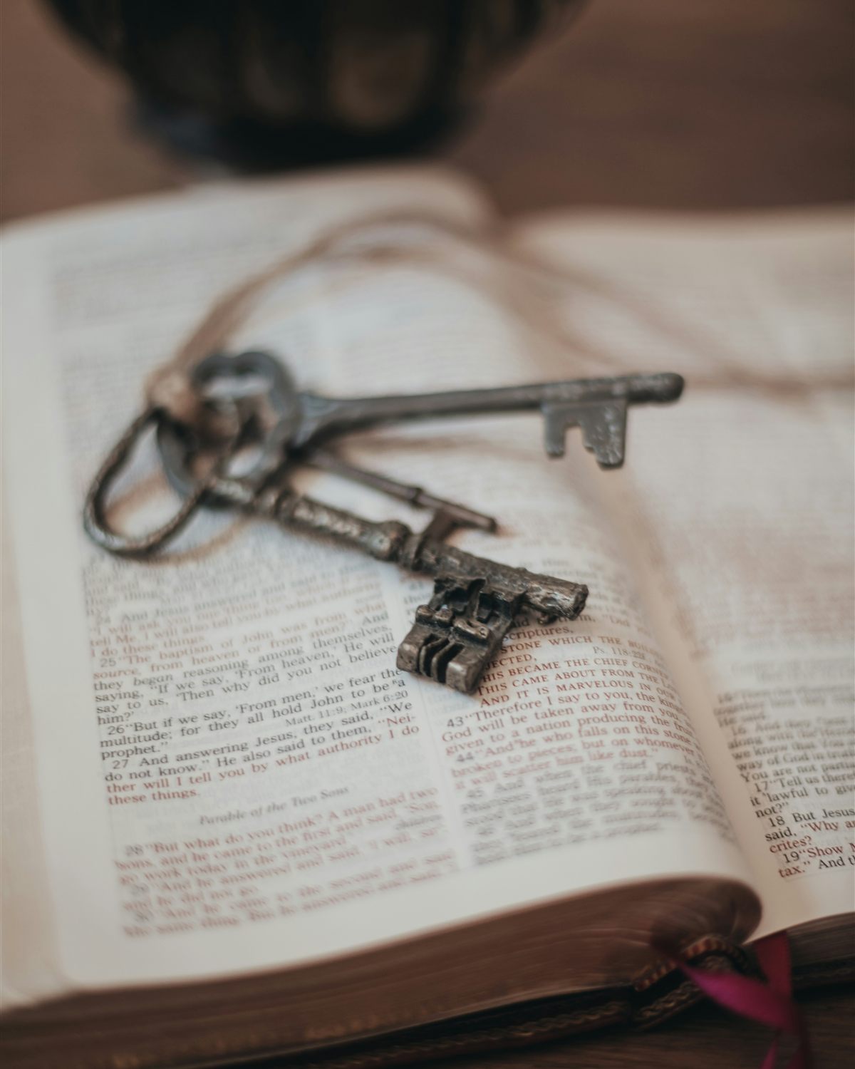 Antique keys resting on the pages of an open book